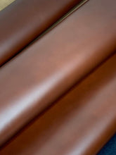 Load image into Gallery viewer, A Beautiful Classic Brush Off Goat, that once brushed off - either buy hand or on a wheel - gives an expensive, cordovan like appearance to any end product. The Tan colour has a lighter shade underneath that shows through when brushed off, whilst the black develops a brilliant, aniline shine. Brush off wherever the natural accents of your finished product are or wherver you would like the base colour to show through, to create truly one of a kind pieces.