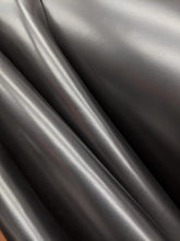 Load image into Gallery viewer, A Beautiful Classic Brush Off Goat, that once brushed off - either buy hand or on a wheel - gives an expensive, cordovan like appearance to any end product. The Tan colour has a lighter shade underneath that shows through when brushed off, whilst the black develops a brilliant, aniline shine. Brush off wherever the natural accents of your finished product are or wherver you would like the base colour to show through, to create truly one of a kind pieces.