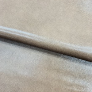 natural, handboarded cross-grain pattern, with a beautiful aniline, polished finish.  Veg Tanned Goat