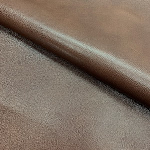 natural, handboarded cross-grain pattern, with a beautiful aniline, polished finish.  Veg Tanned Goat