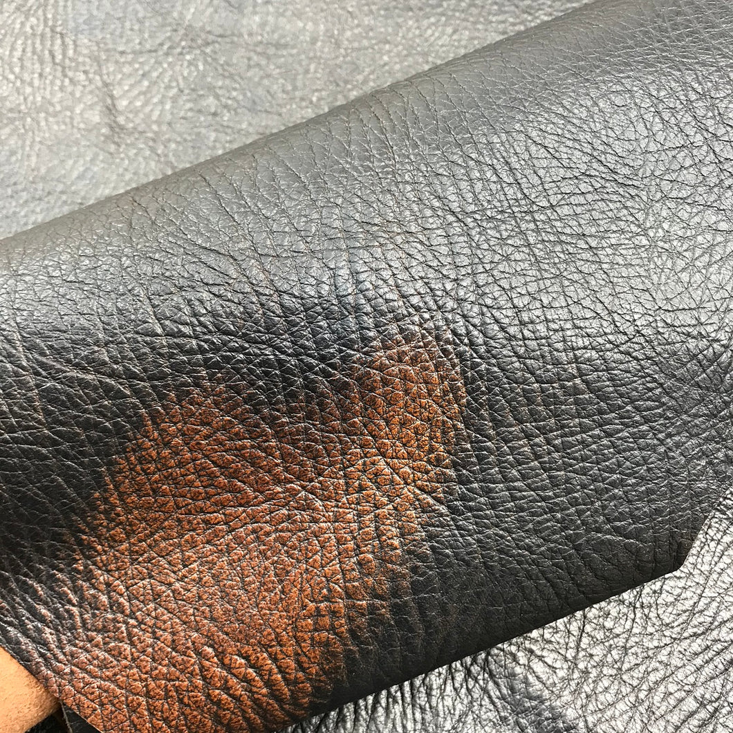 Brush Off Goat Leather with a Black top and Walnut base colour