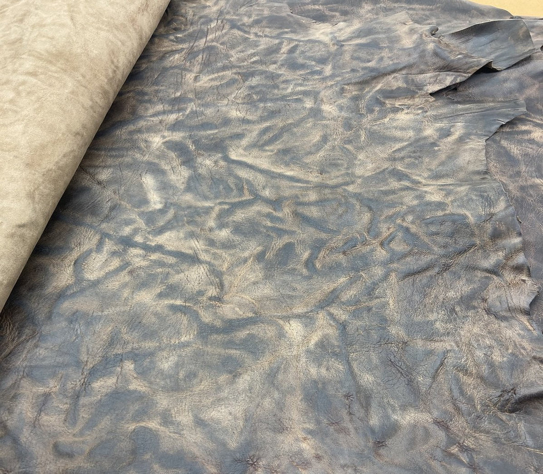 A unique African goat, that's been scrunched, hand washed, tipped and polished,  They have been infused with our unique blend of oils and waxes, to give the leather it's burnishable and polishable attributes.  As each skin is produced by hand, they're all one of a kind.