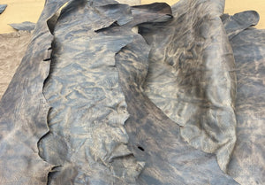 A unique African goat, that's been scrunched, hand washed, tipped and polished,  They have been infused with our unique blend of oils and waxes, to give the leather it's burnishable and polishable attributes.  As each skin is produced by hand, they're all one of a kind.