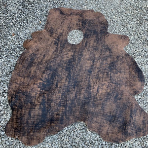 A very unique article, this distressed, two tone antiqued Cow Calf has been distressed by hand, so no two skins will ever look the same.
