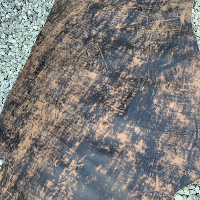 A very unique article, this distressed, two tone antiqued Cow Calf has been distressed by hand, so no two skins will ever look the same.