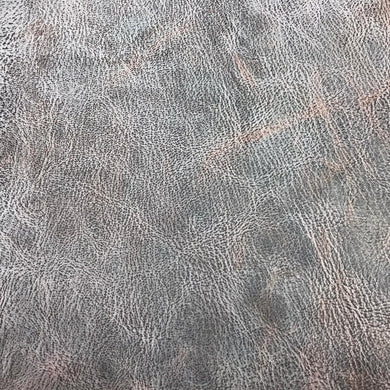 A Milled Grain Goat Skin with a White Wax Finish that is Reversible, with a natural finish that can be polished and burnished on either the grain or suede side.